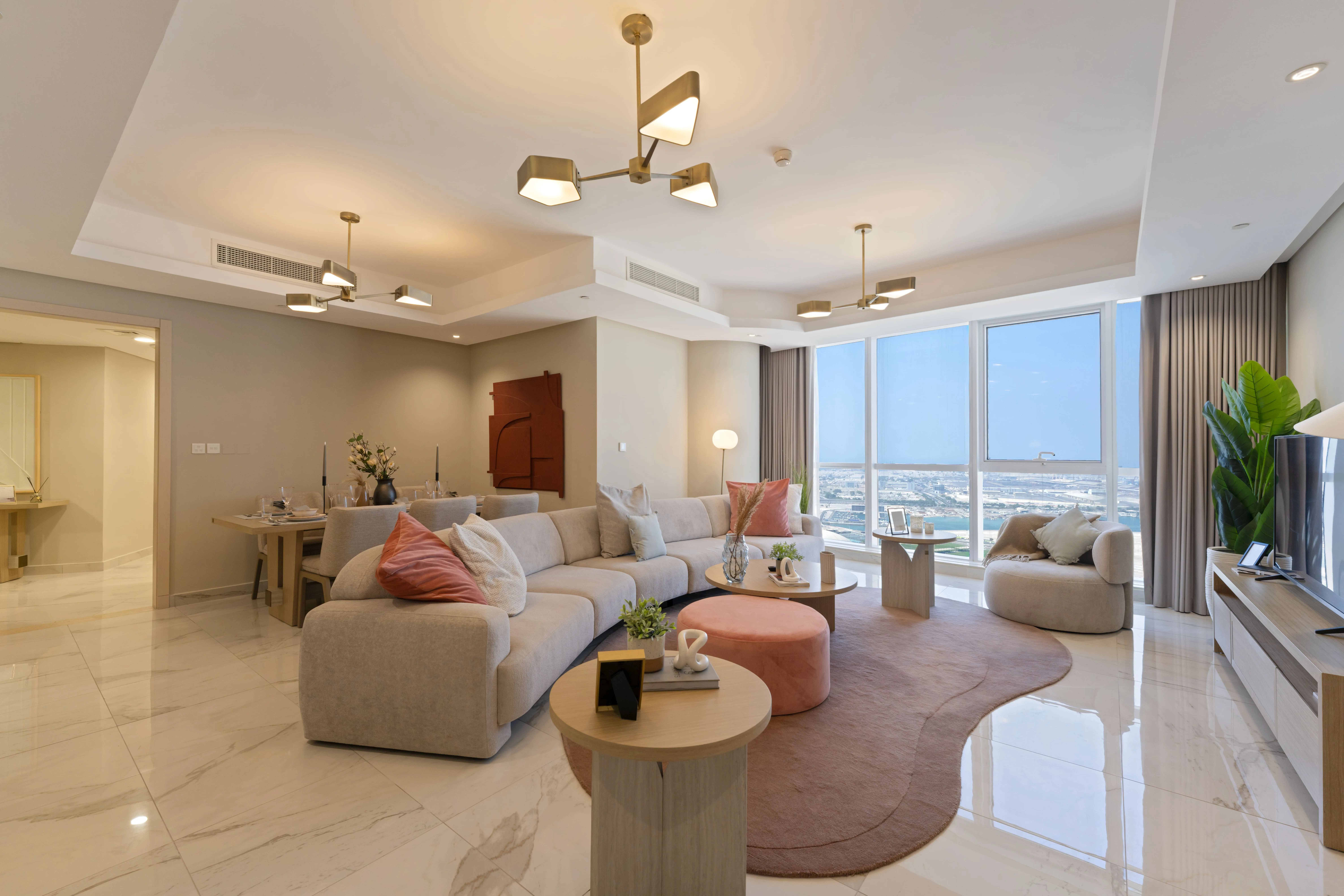 Spacious living area inside Leaf Tower apartments with elegant modern finishes.
