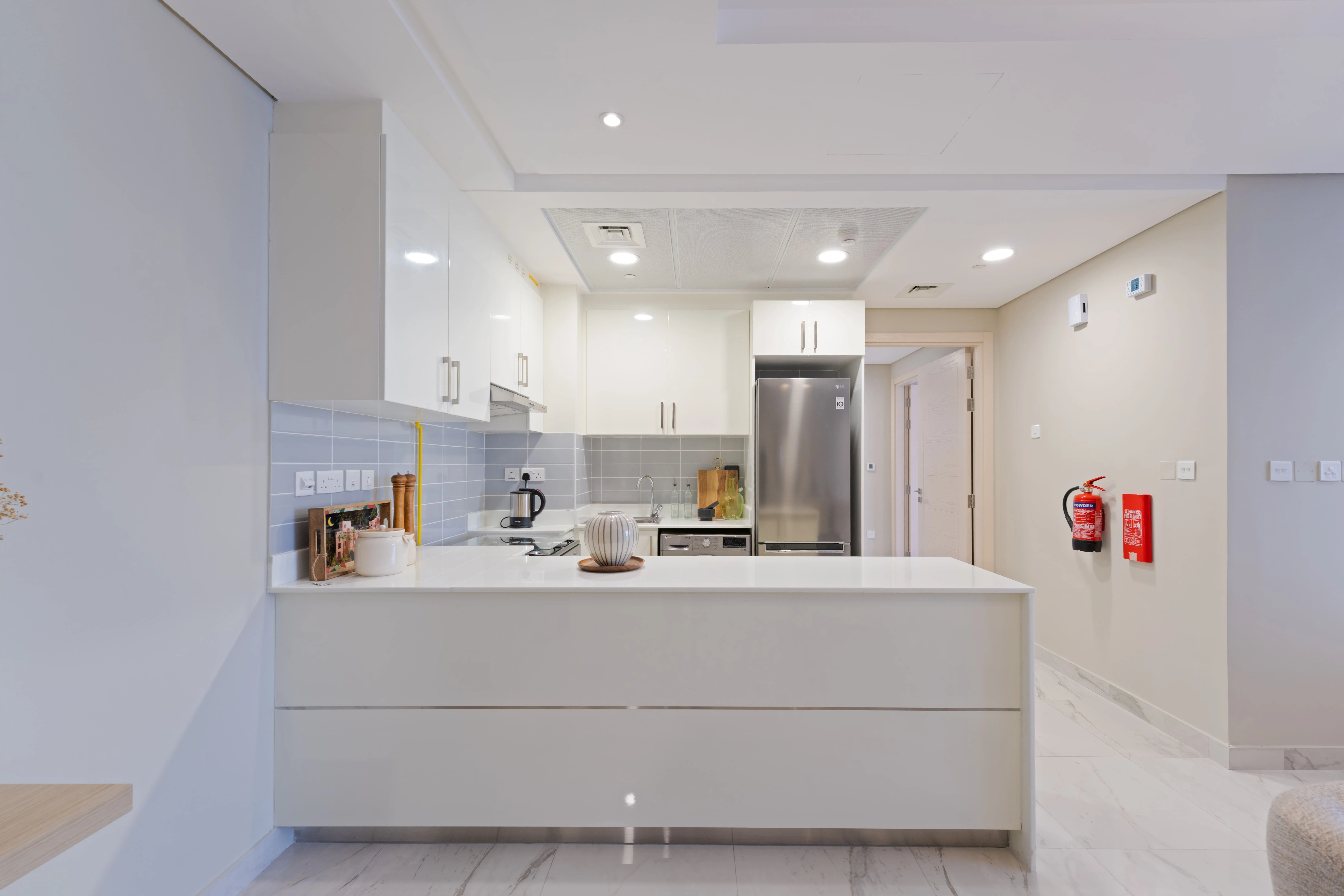 Contemporary kitchen at Leaf Tower featuring sleek cabinetry and quality finishes.