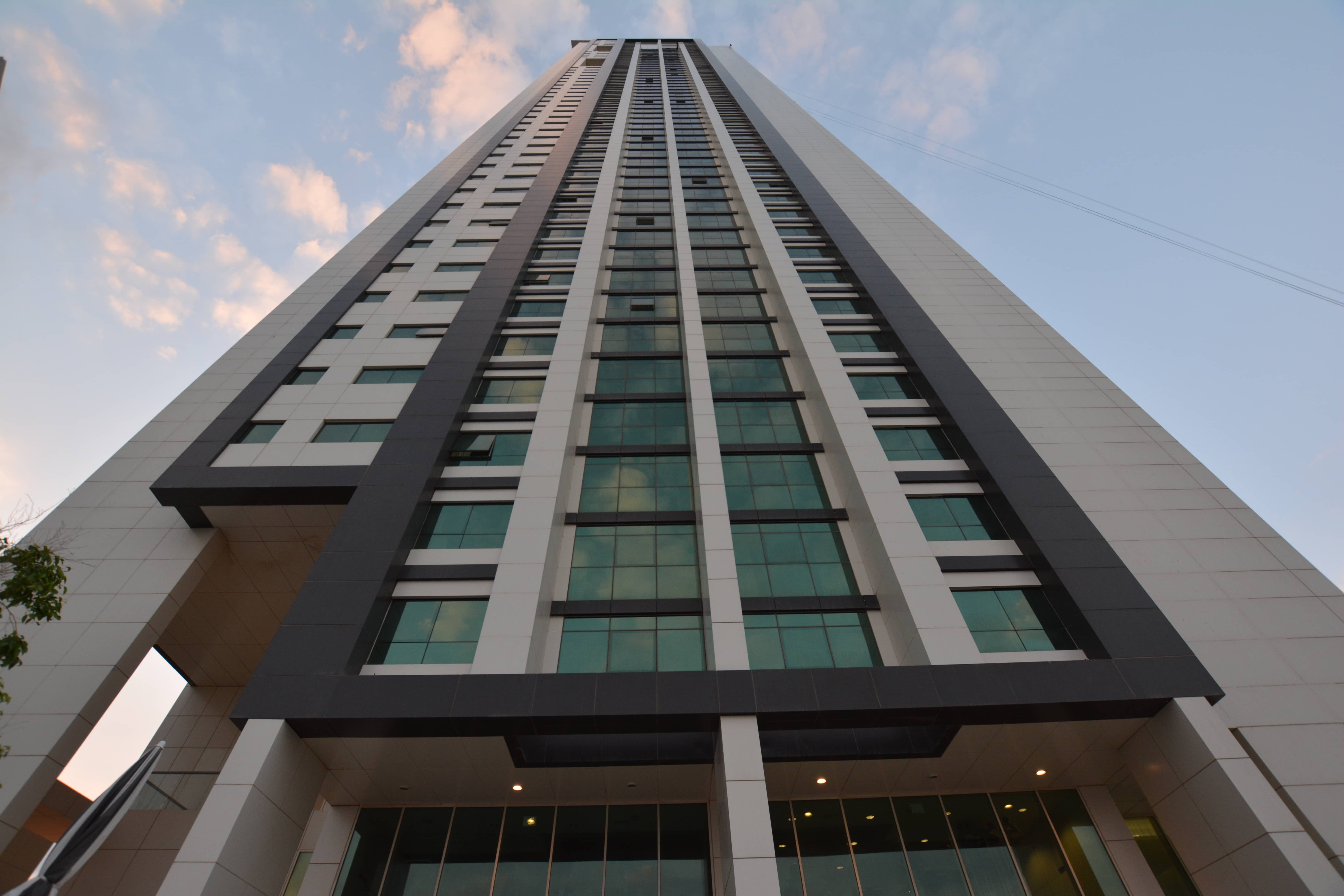 Front façade of Marina Blue Tower in Marina Square, Al Reem Island displaying luxury residential tower and landscaped surroundings.